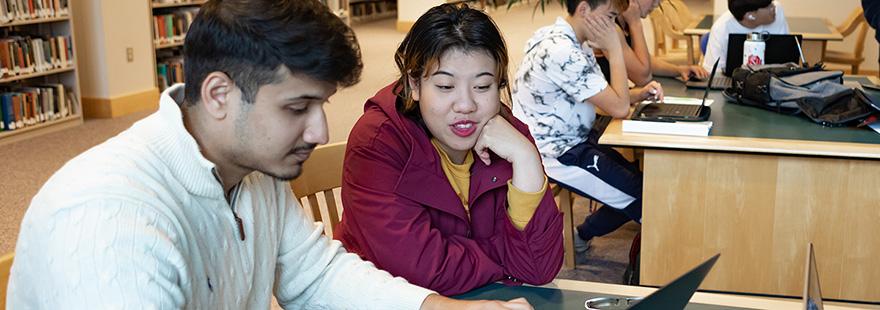 Two SPU students do research in the Ames Library | photo by Chris Yang